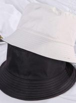 Plain black and white reversible bucket hat