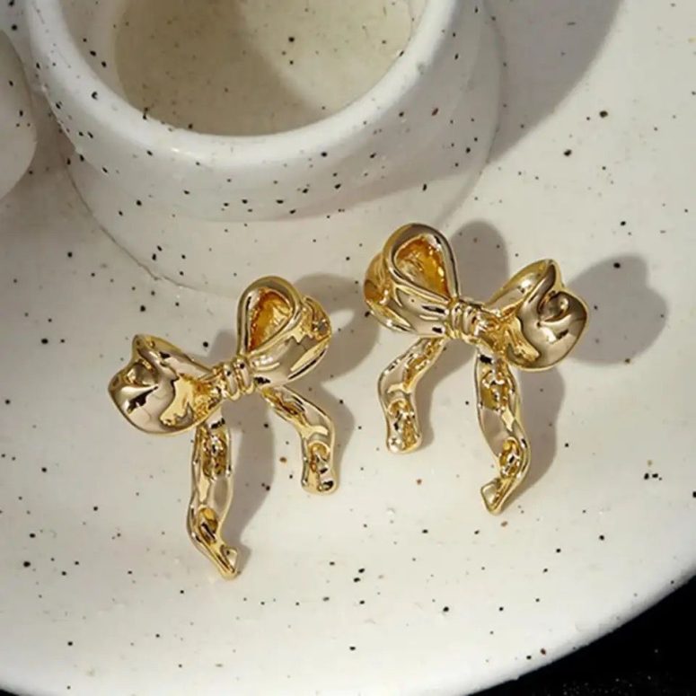 gold bow-shaped earrings